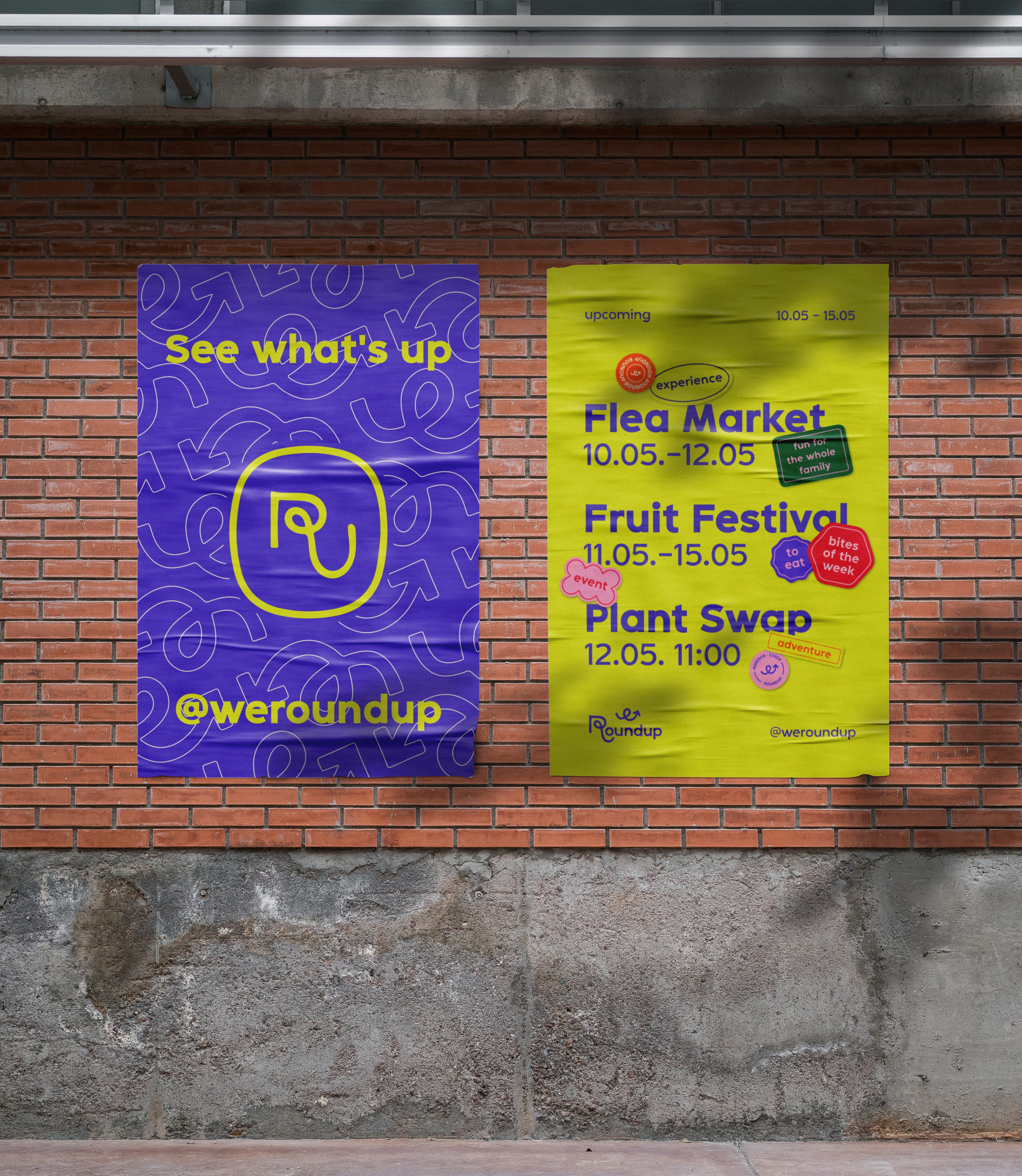 WE Roundup promo posters on a brick wall